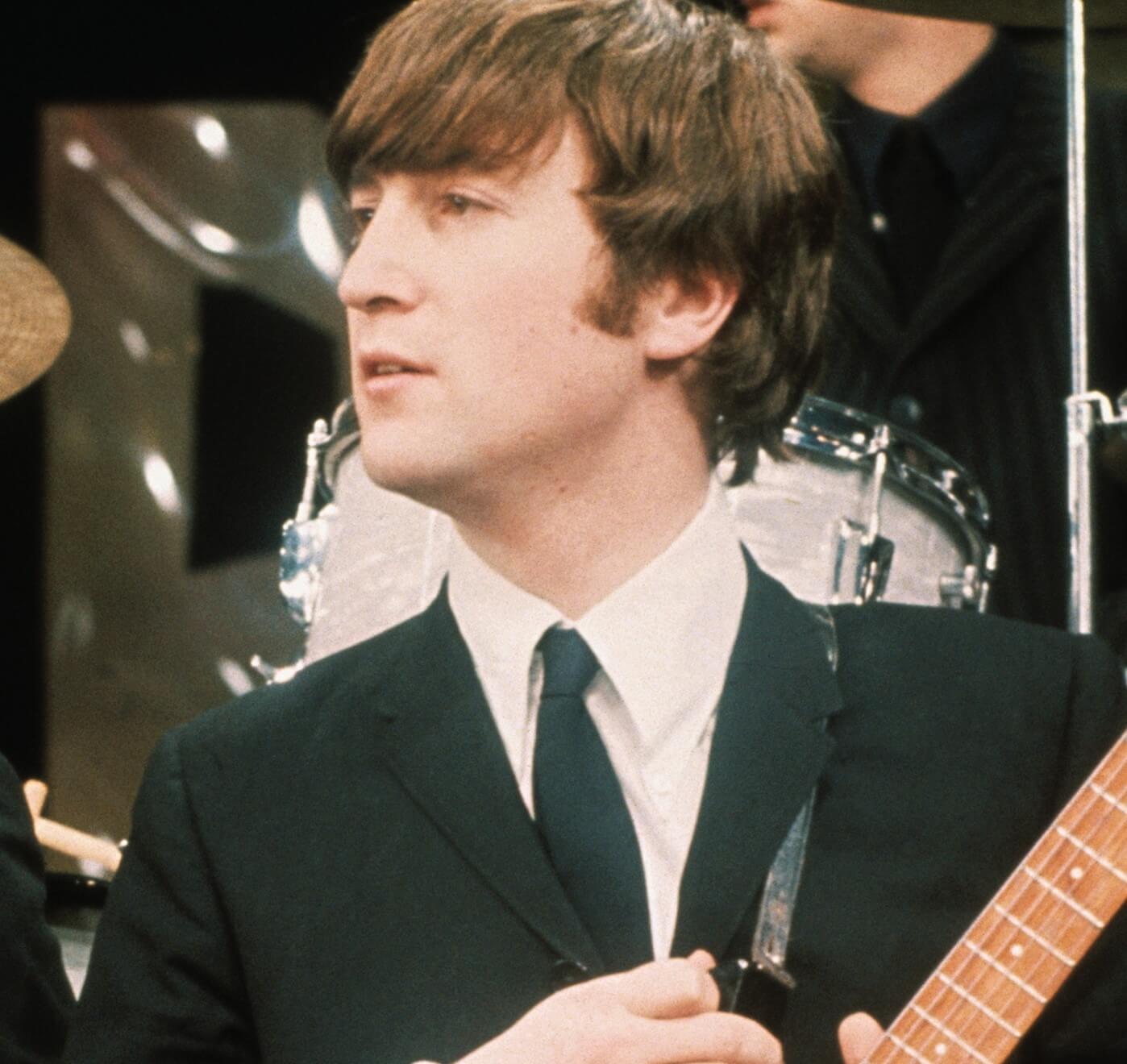 John Lennon wearing a suit