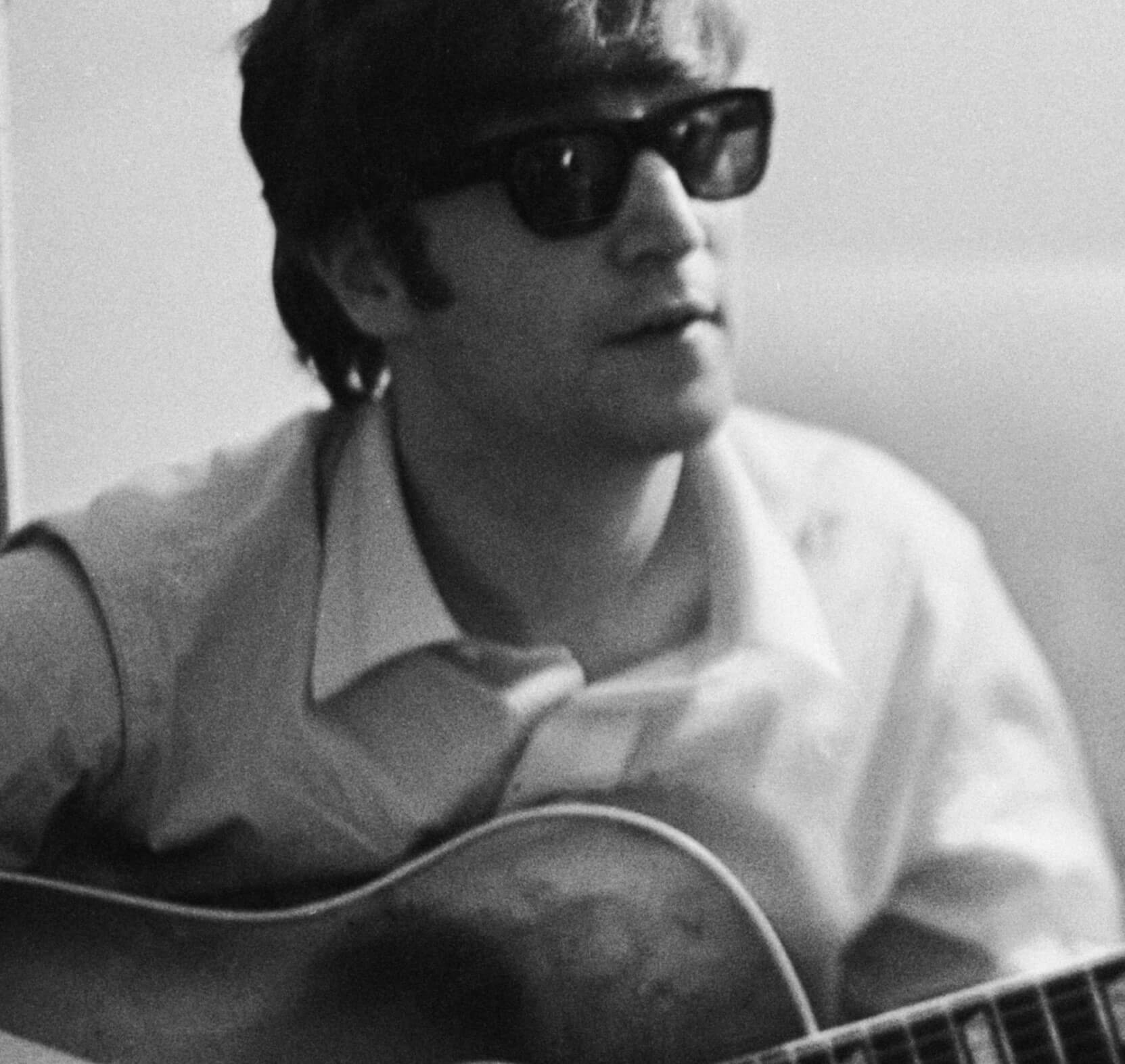 John Lennon wearing glasses