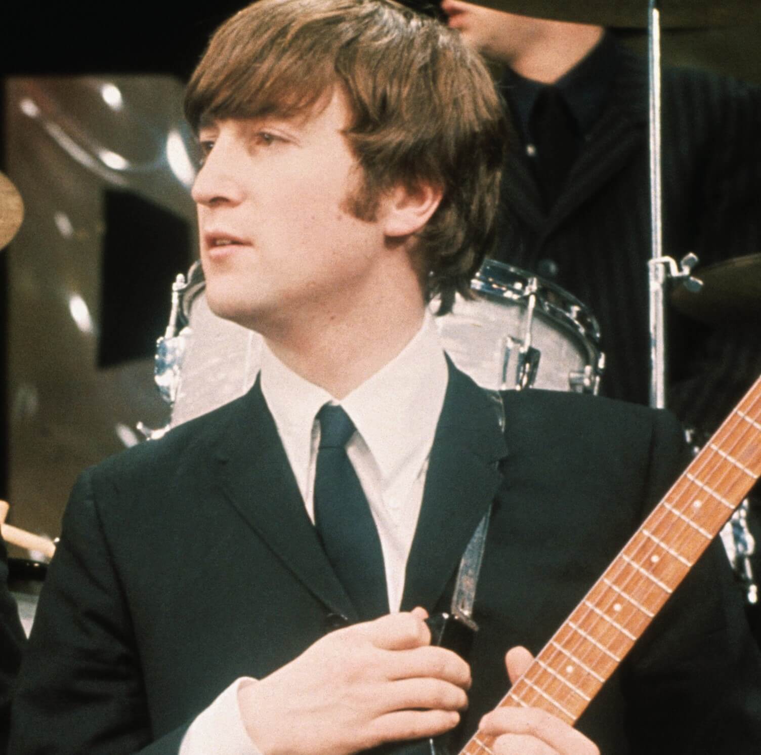 The Beatles' John Lennon wearing a suit