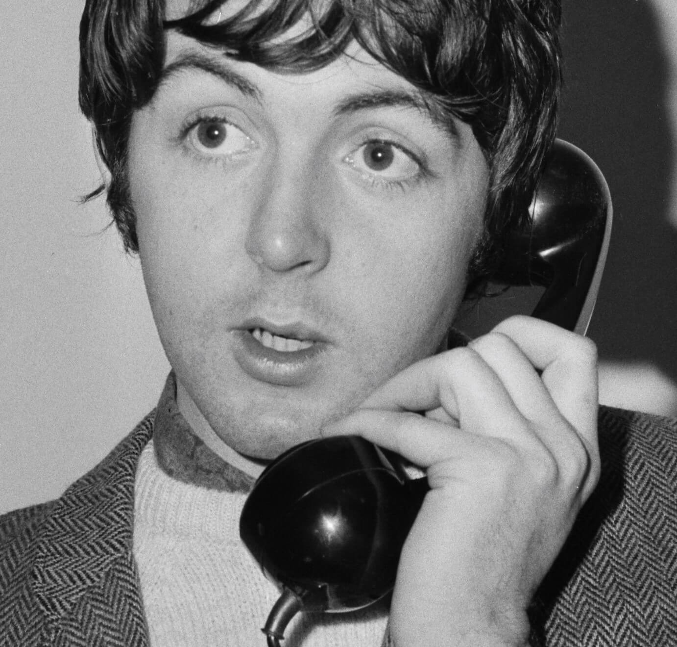 Paul McCartney with a telephone