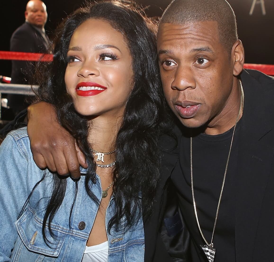 Jay-Z with his arm around Rihanna