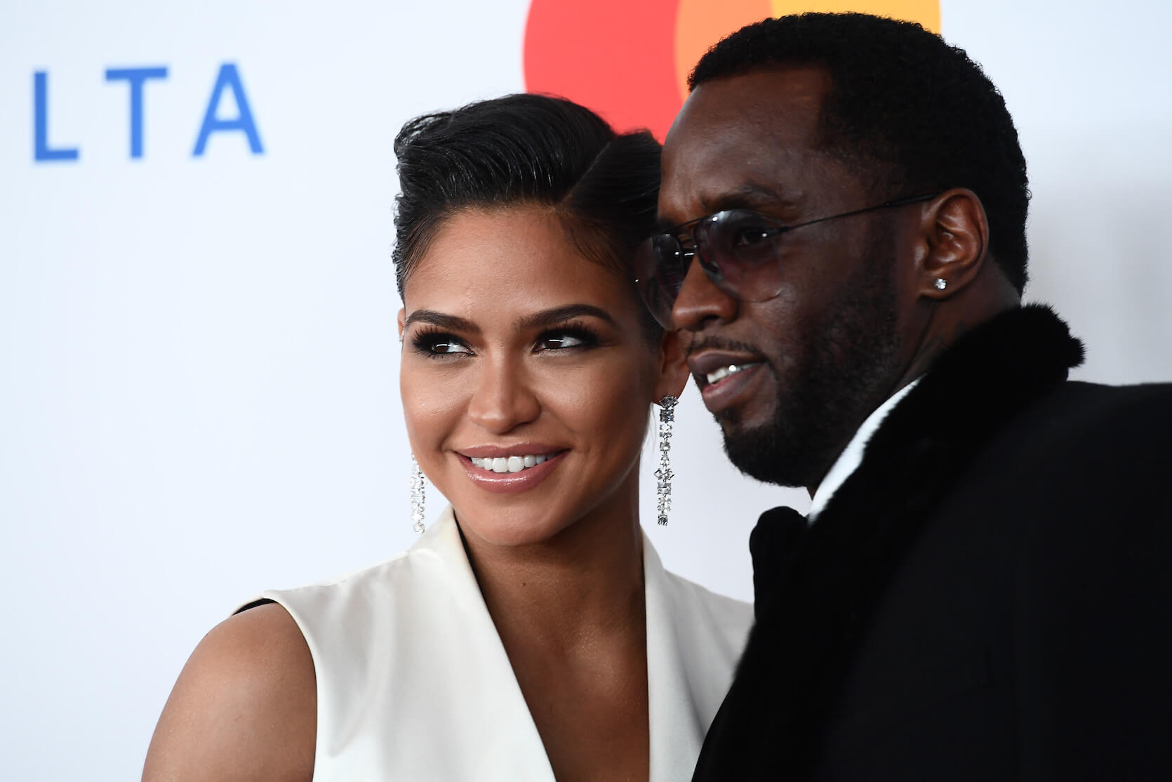 A close-up of Cassie Ventura and Sean 'P. Diddy' Combs smiling with their heads next to each other