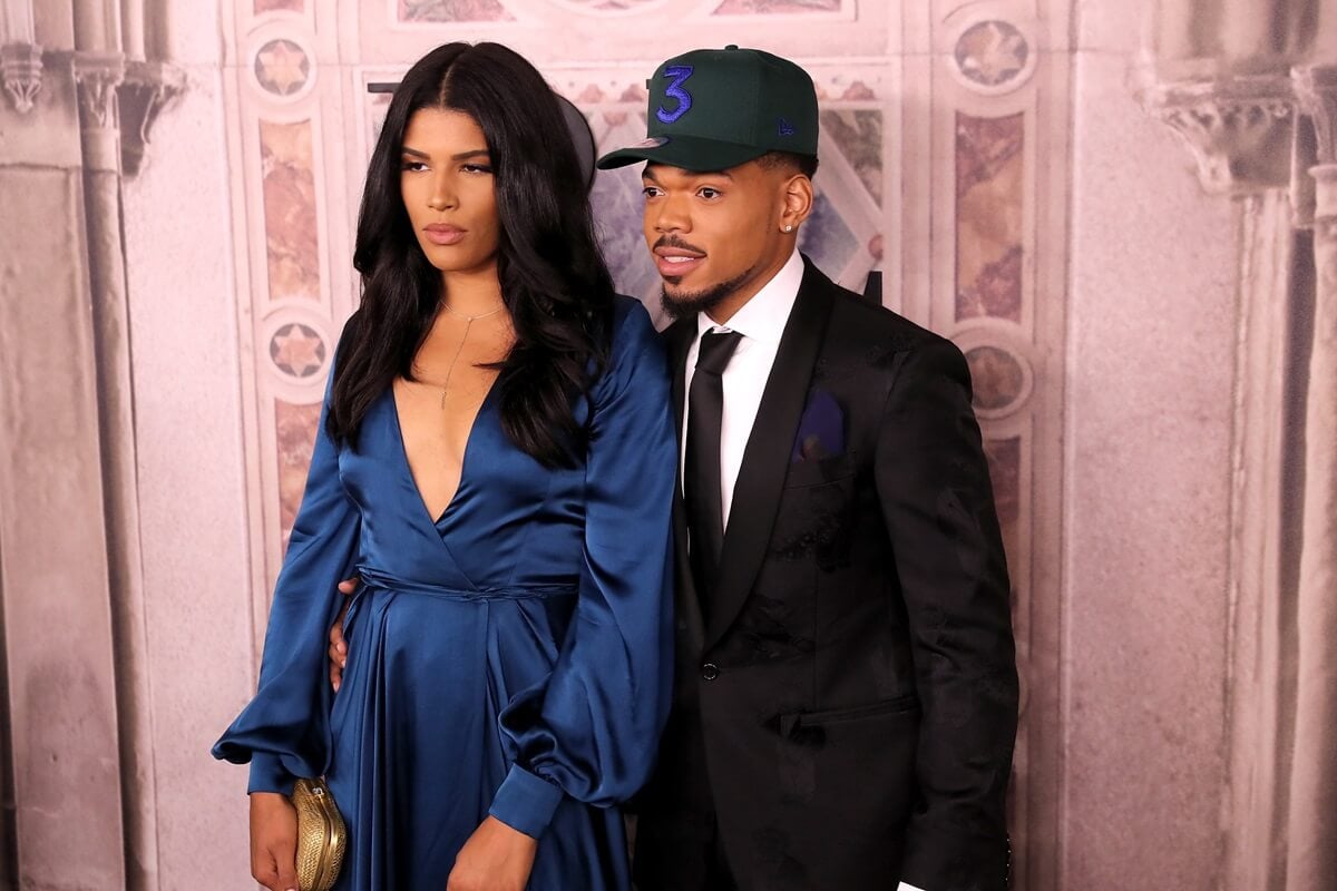Chance the Rapper and Kirsten Corley posing next to each other at the Ralph Lauren fashion show during New York Fashion Week.