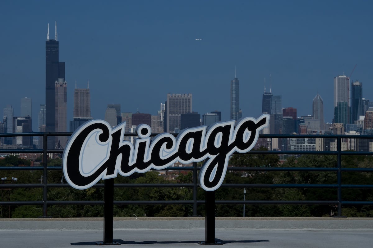A 'Chicago' sign against the backdrop of the city's skyline