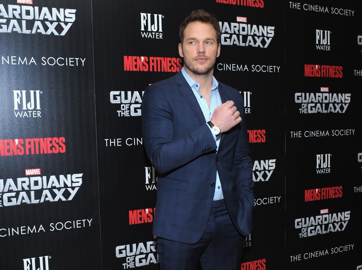 Chris Pratt posing in a suit at the premiere of 'The Guardians of the Galaxy'.