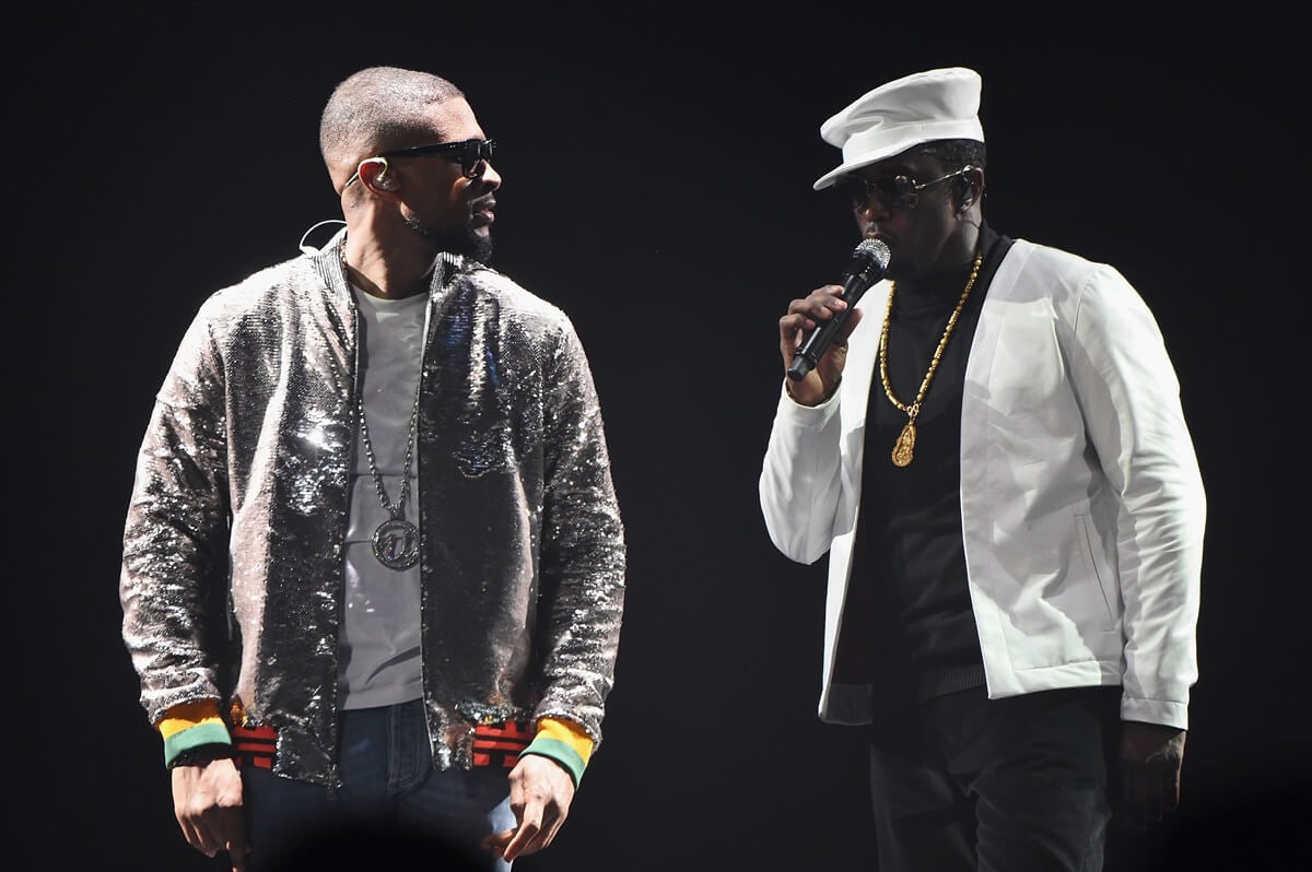 Diddy and Usher performing on stage during the Bad Boys reunion tour.
