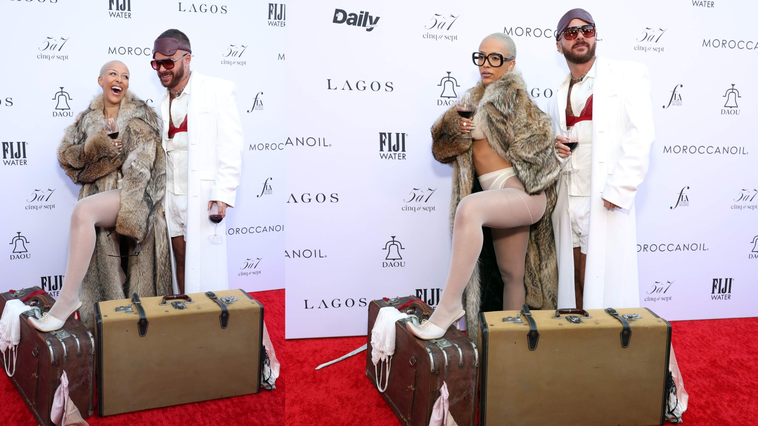 Rapper/singer Doja Cat and Brett Alan Nelson laugh together on the red carpet as they hold glasses of wine