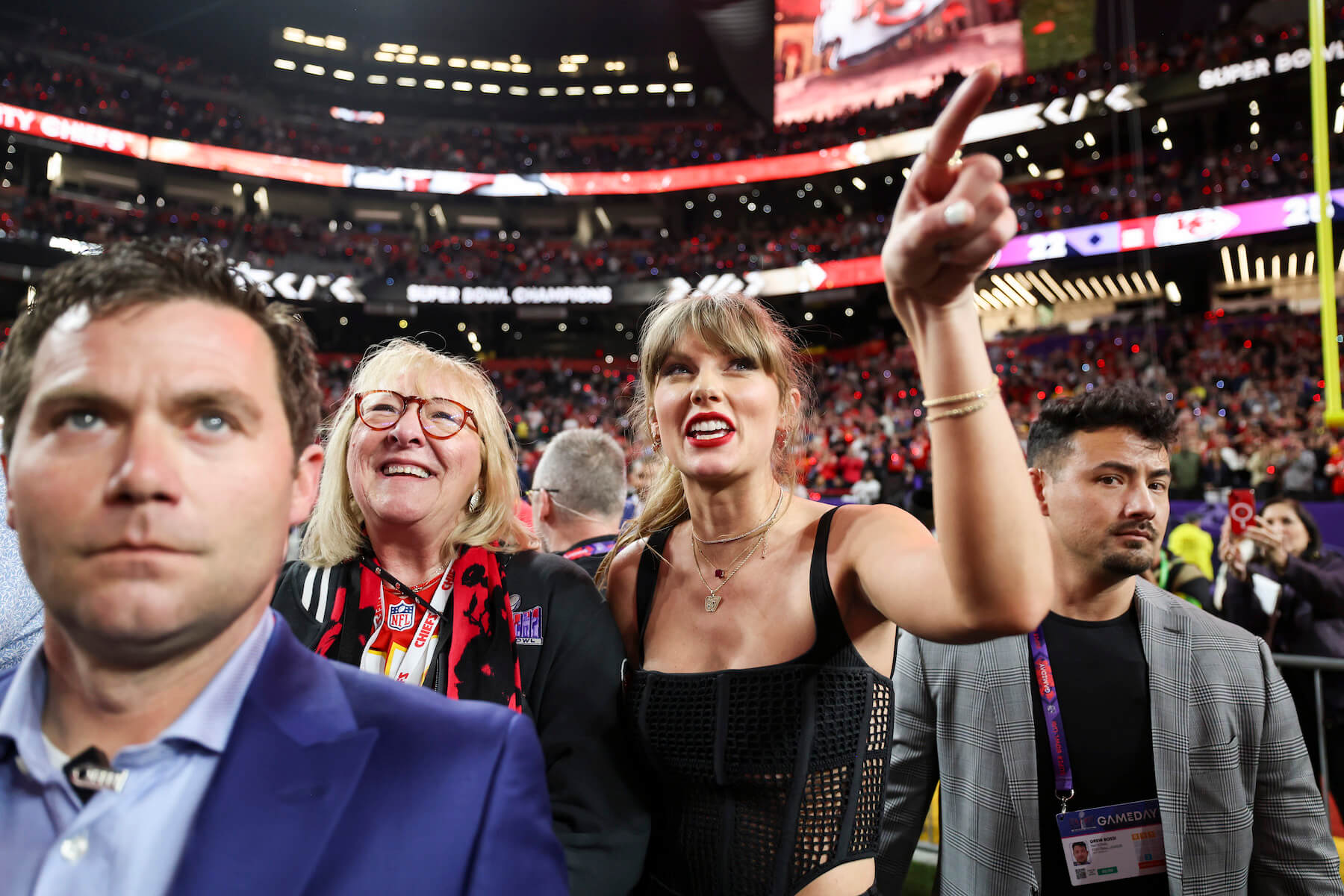 Donna Kelce and Taylor Swift standing next to each other in a crowd during Super Bowl LVIII