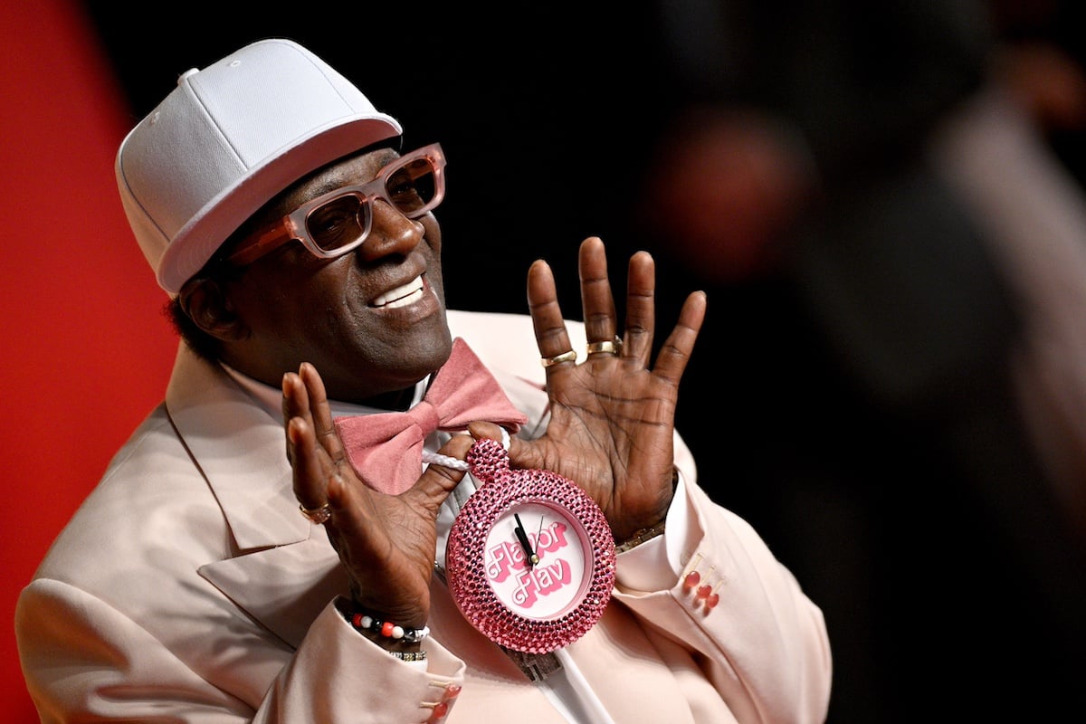 Flavor Flav wearing a bedazzled Barbie clock