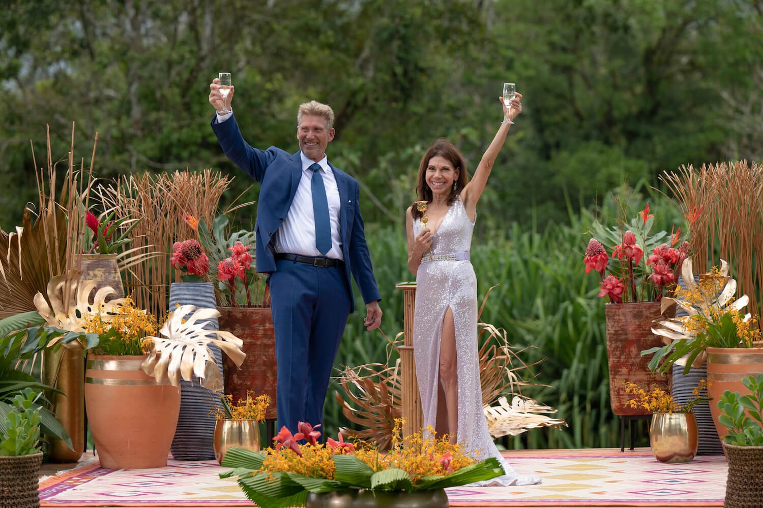Gerry Turner and Theresa Nist on 'The Golden Bachelor' finale holding up champagne to toast