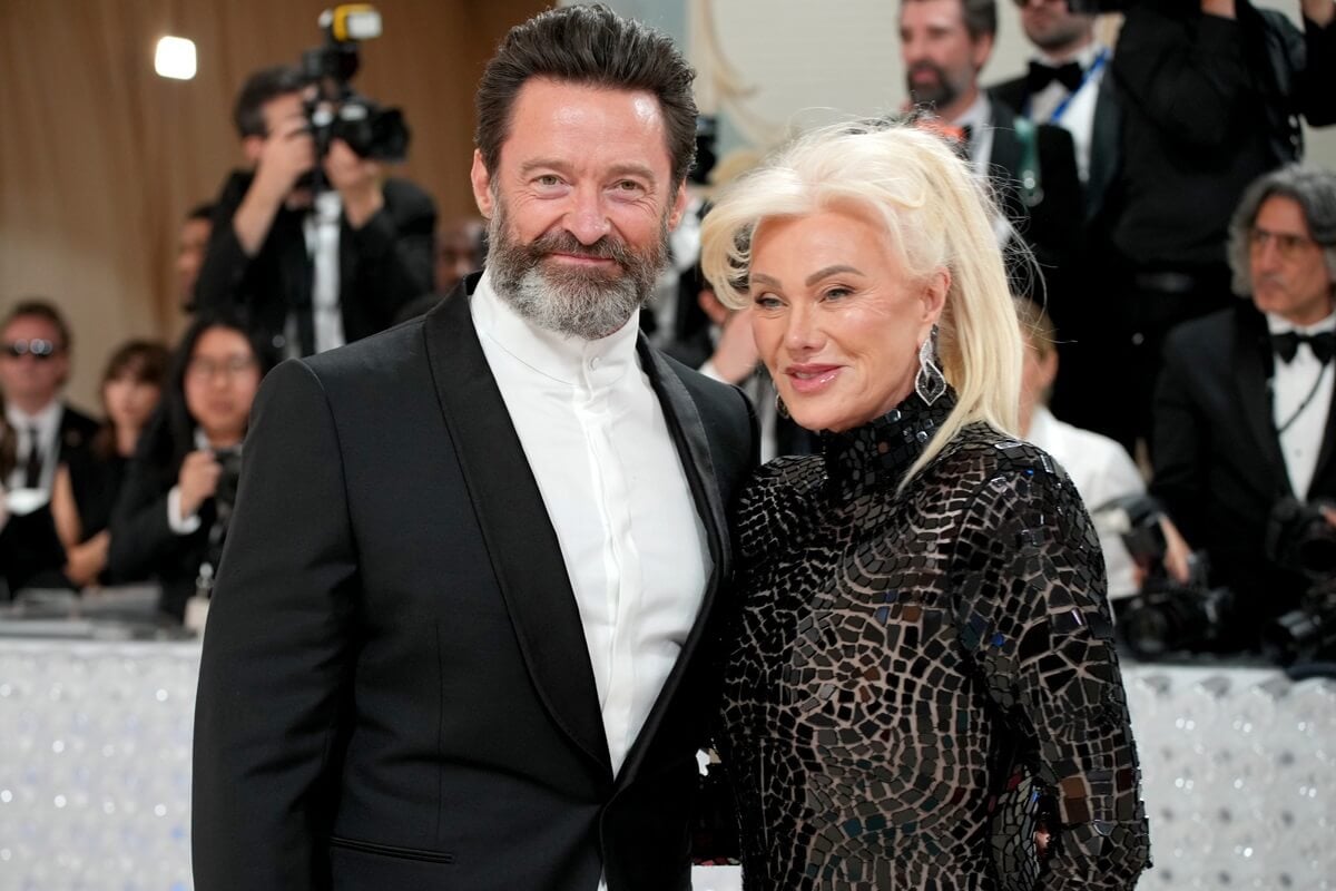 Hugh Jackman and Deborra-Lee Furness attends the 2023 Met Gala Celebrating "Karl Lagerfeld: A Line Of Beauty" while wearing a suit and dress respectively.