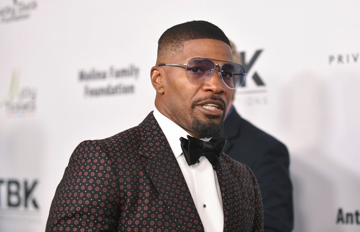 Jamie Foxx posing in a suit at the 2022 Harold and Carole Pump Foundation Gala at The Beverly Hilton.