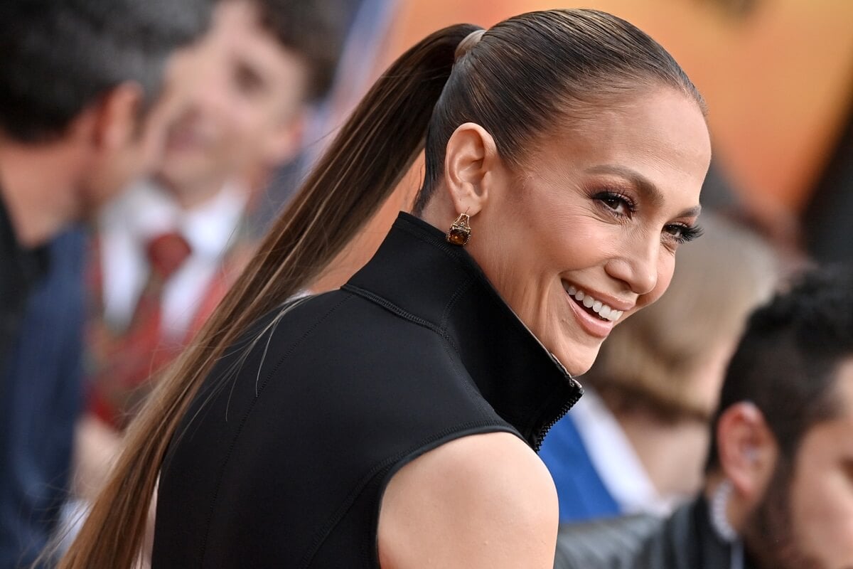 Jennifer Lopez posing at the premiere of 'The Flash' in a black outfit.