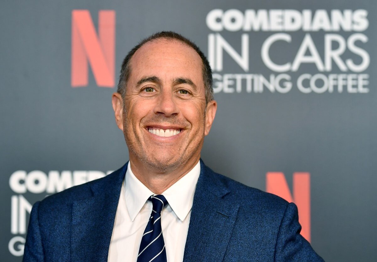 Jerry Seinfeld posing in a blue suit at the LA Tastemaker event for Comedians in Cars at The Paley Center for Media.