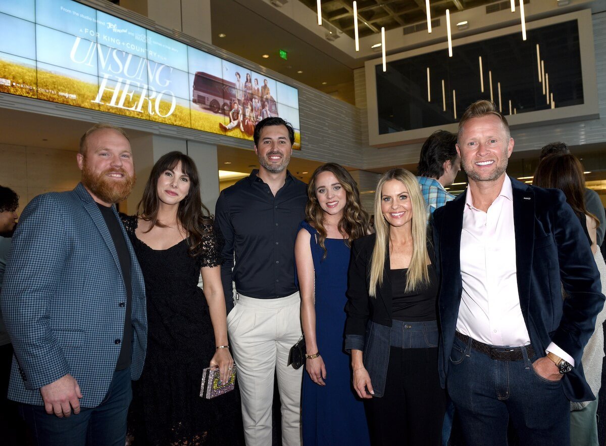 Jinger Duggar and Jeremy Vuolo pose for a photo with Candace Cameron Bure and Valeri Bure and another couple at a screening of 'Unsung Hero'