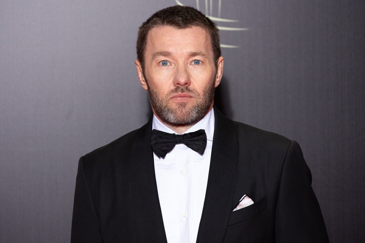 Joel Edgerton posing in a suit at the closing ceremony during the 20th Marrakech International Film Festival.