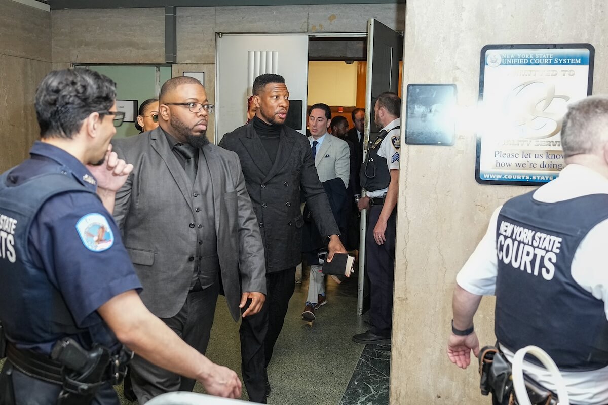 Jonathan Majors walks out of a courtroom in Manhattan