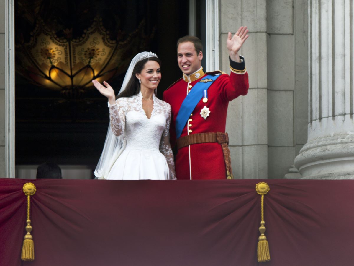 Kate Middleton and Prince William wave to well-wishers from the balcony at Buckingham Palace after their wedding