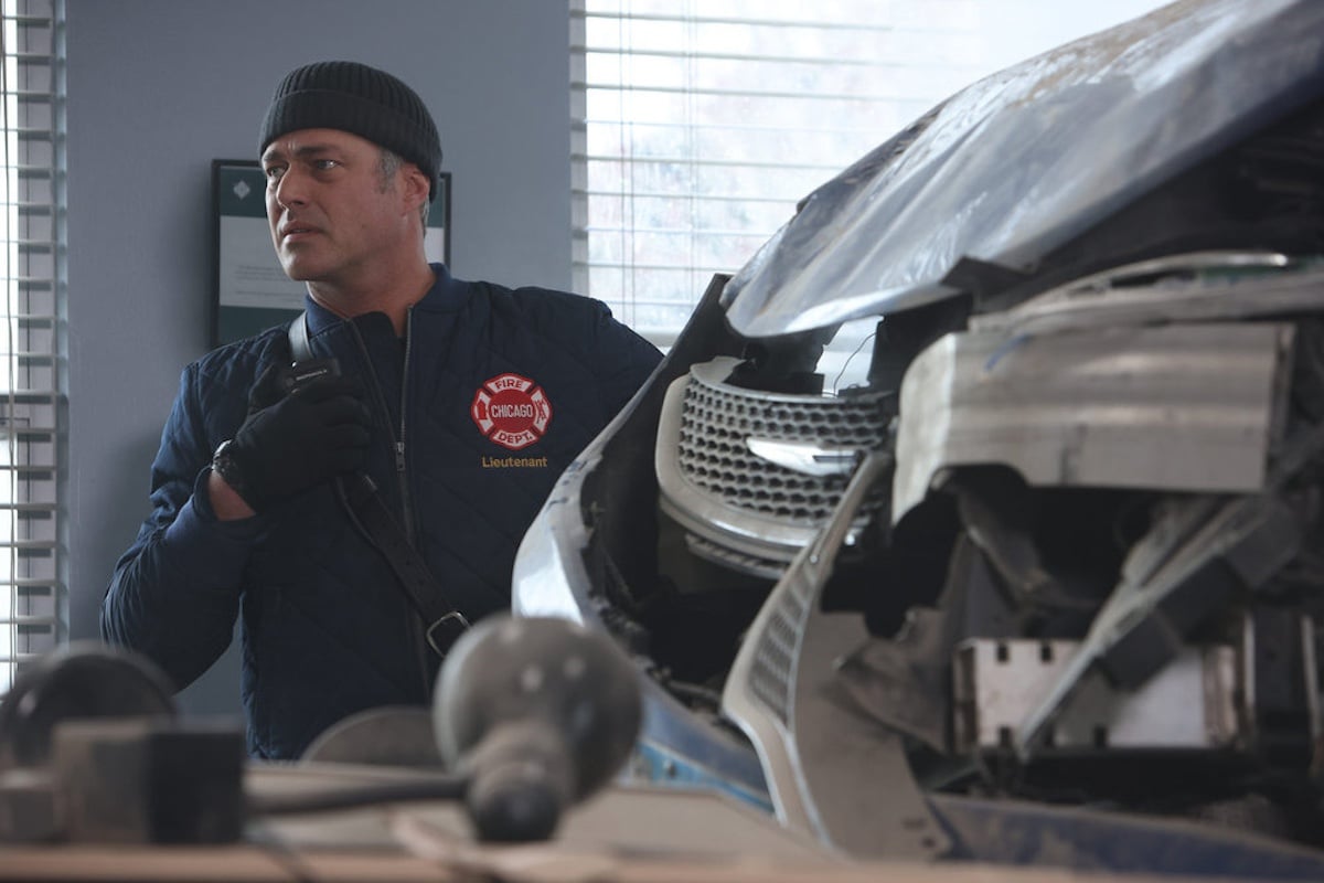 Kelly Severide in front of a crashed car in 'Chicago Fire' Season 12 Episode 10