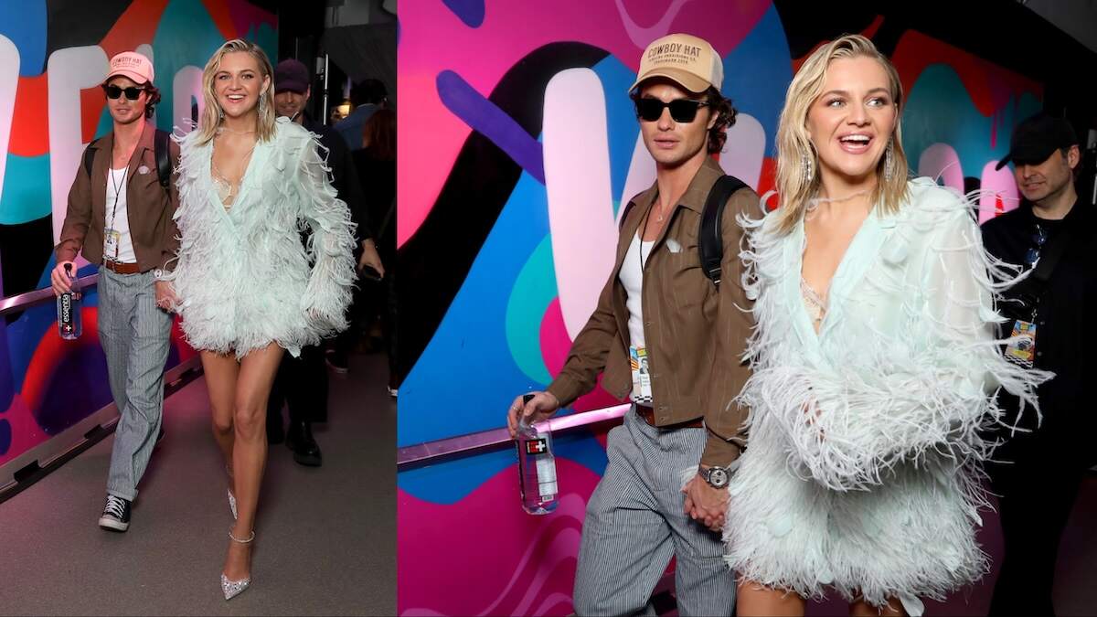 Actor Chase Stokes and singer Kelsea Ballerini laugh and walk together backstage at the 2024 CMT Music Awards