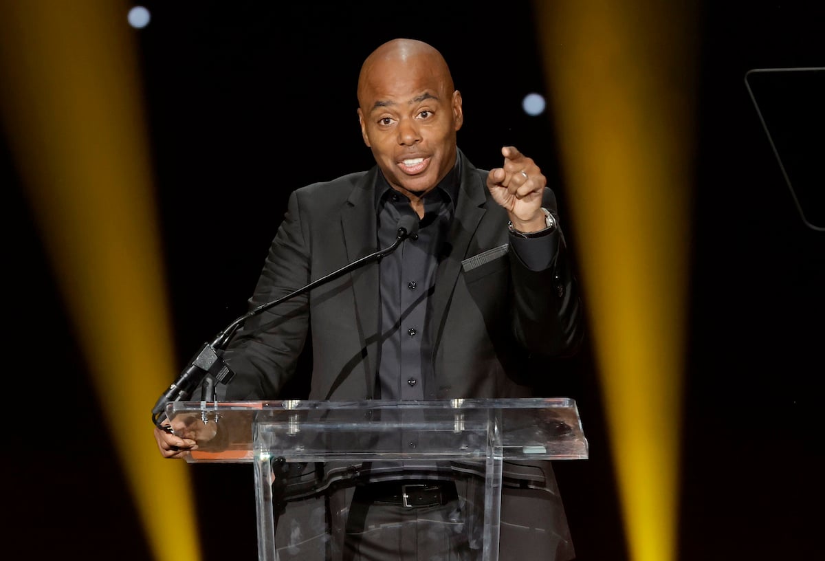 Kevin Frazier standing behind a lectern and pointing a finger