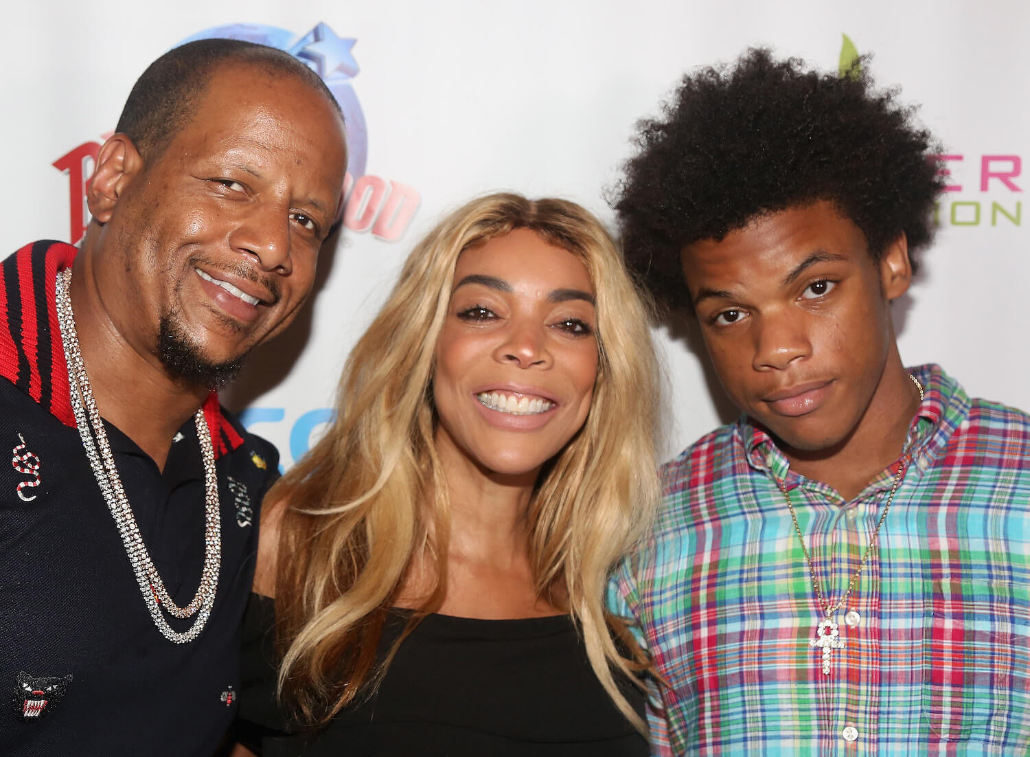 Kevin Hunter, Wendy Williams, and Kevin Hunter Jr. standing with each other for a photo in 2017