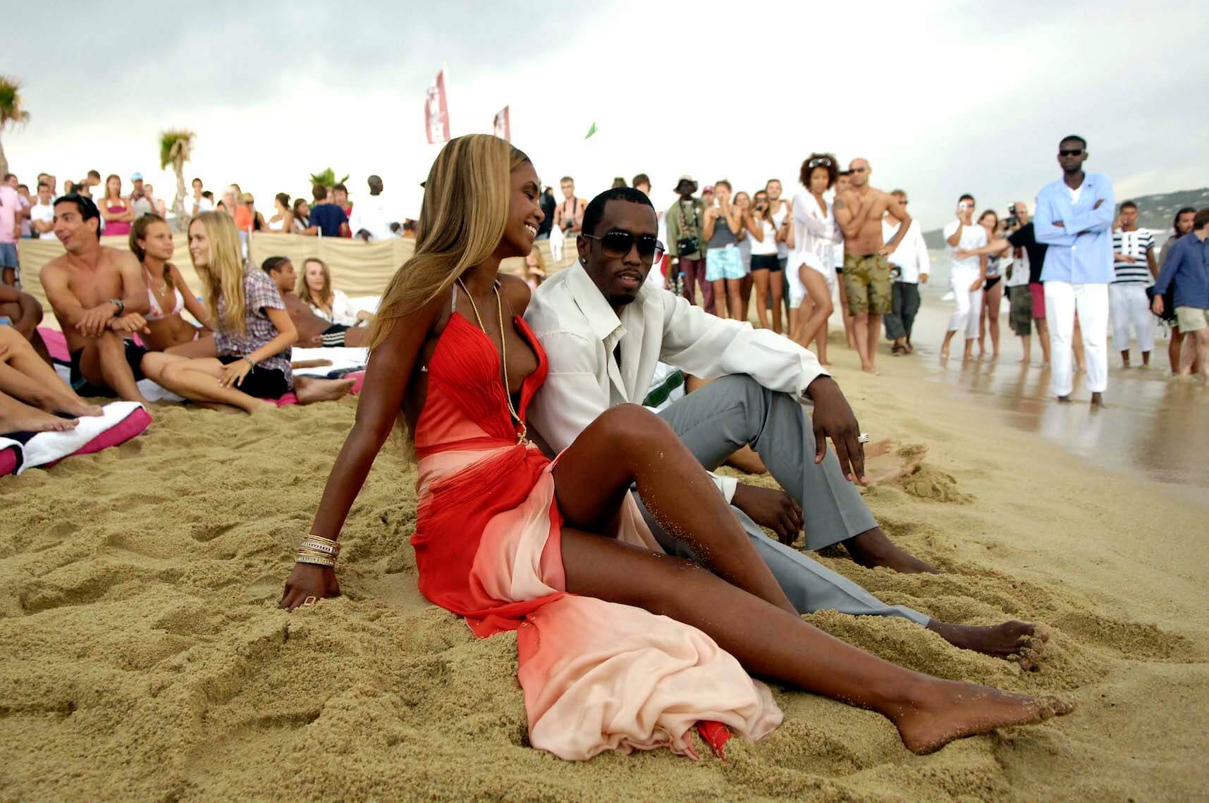 Sean 'P. Diddy' Combs and Kim Porter sitting on a beach in Monaco for a fragrance campaign in 2006