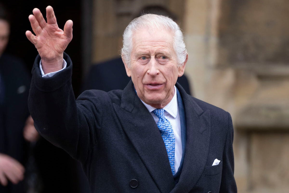 King Charles III, whose staff is hoping to schedule Commonwealth meeting on UK time, waves