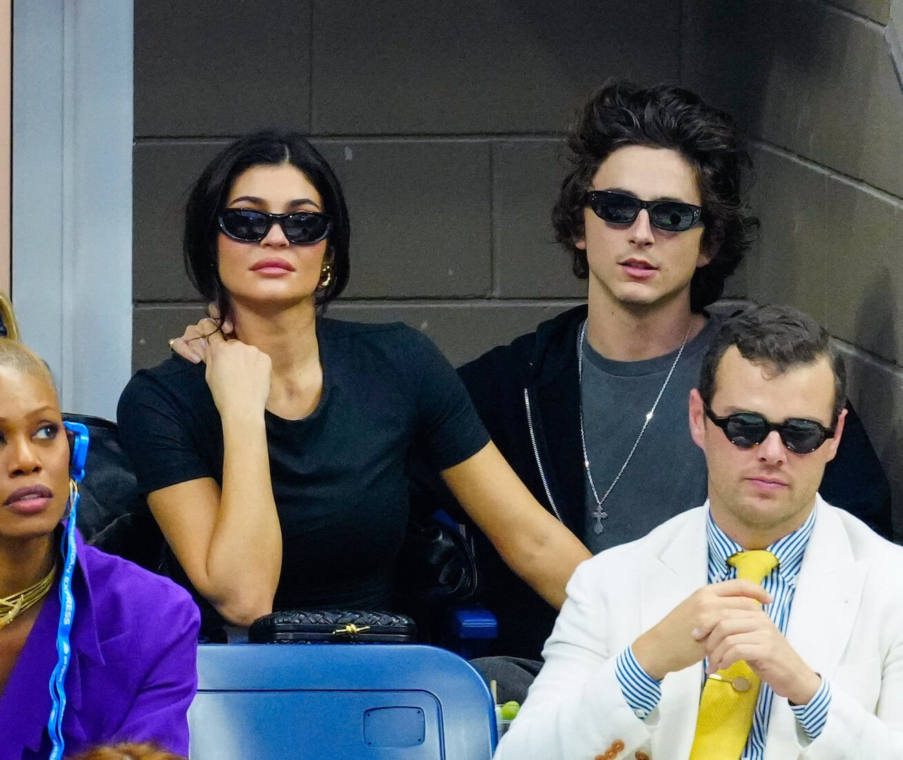 Kylie Jenner and Timothée Chalamet sitting next to each other and wearing sunglasses at the 2023 US Open Tennis Championships