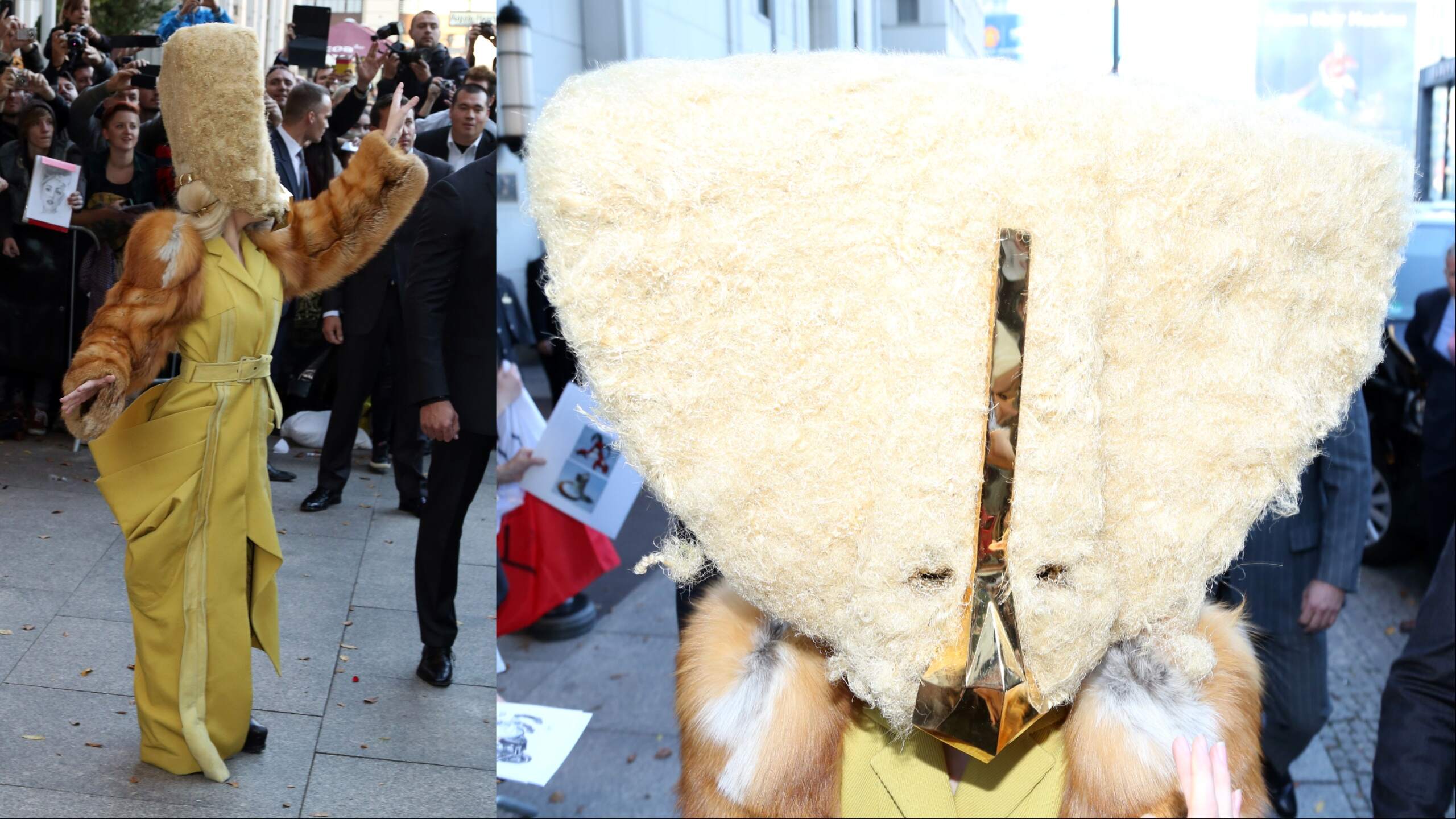 Singr Lady Gaga wears a furry head covering and waves to fans