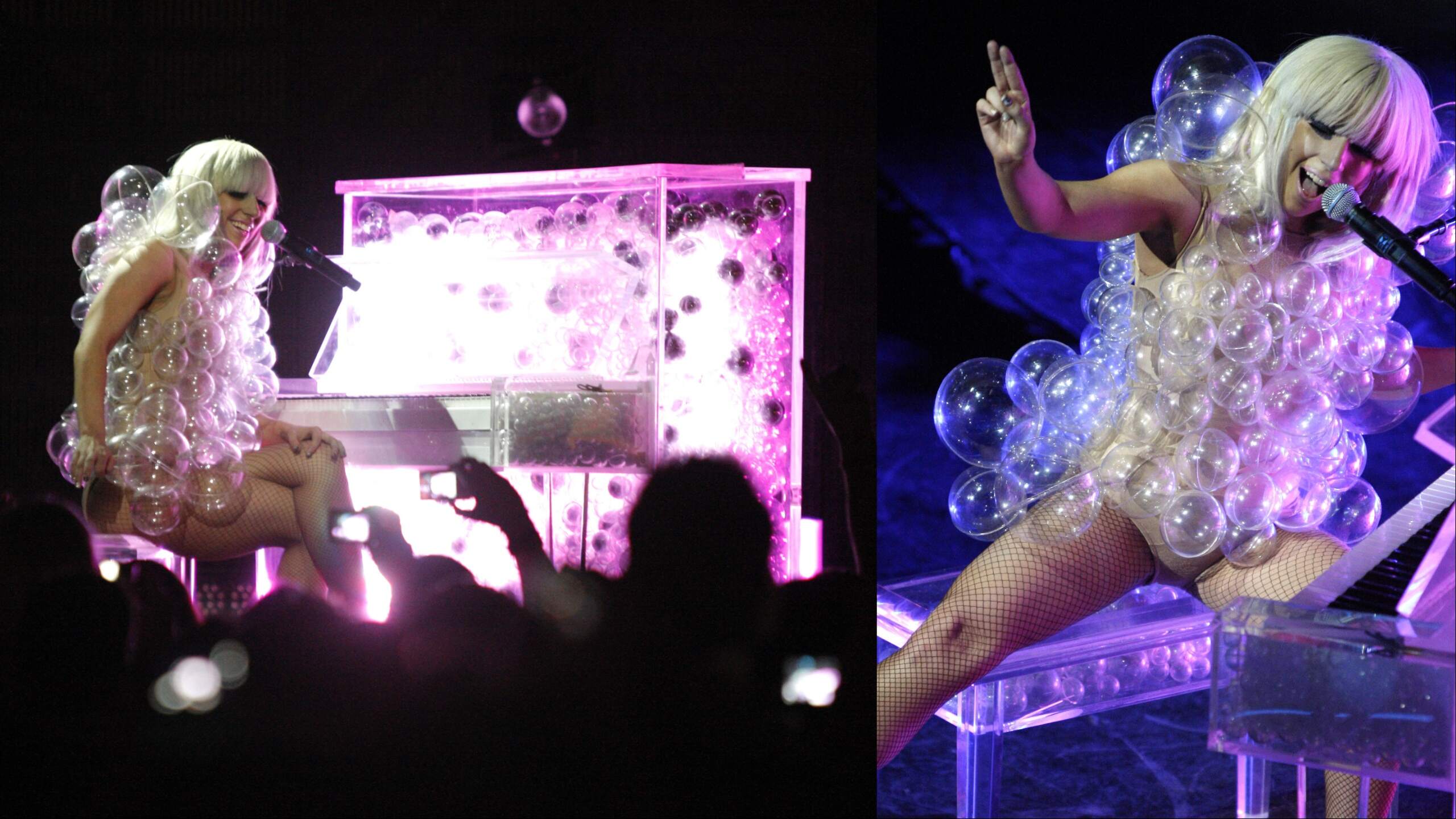 Singer Lady Gaga is covered in plastic bubbles as she plays the piano
