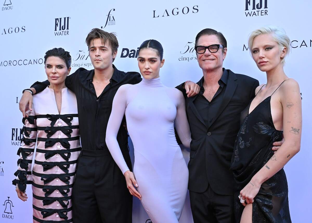 The Rinna-Hamlin family, Lisa Rinna, Henry Eikenberry, Amelia Gray, Harry Hamlin, and Delilah Belle, pose on the red carpet together in formalwear