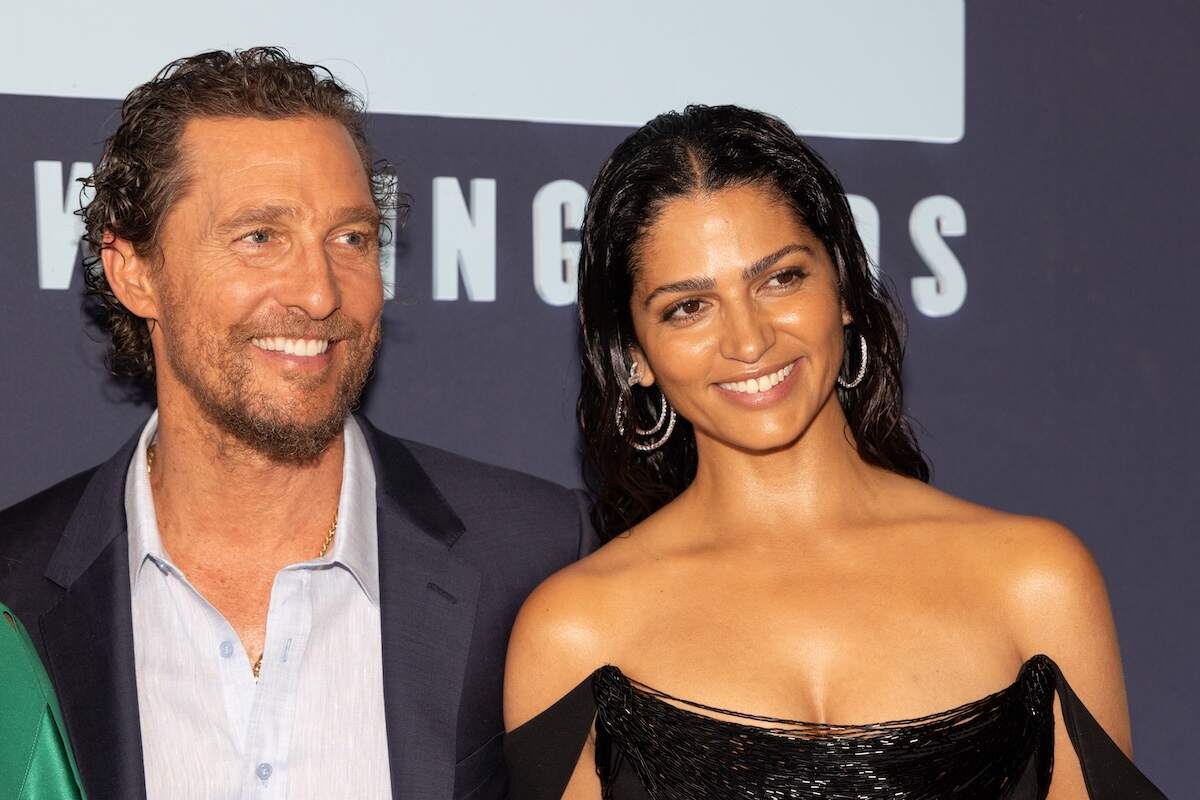 Married couple Matthew McConaughey and Camila Alves McConaughey smile together on the red carpet of the 12th Annual Mack, Jack & McConaughey Gala
