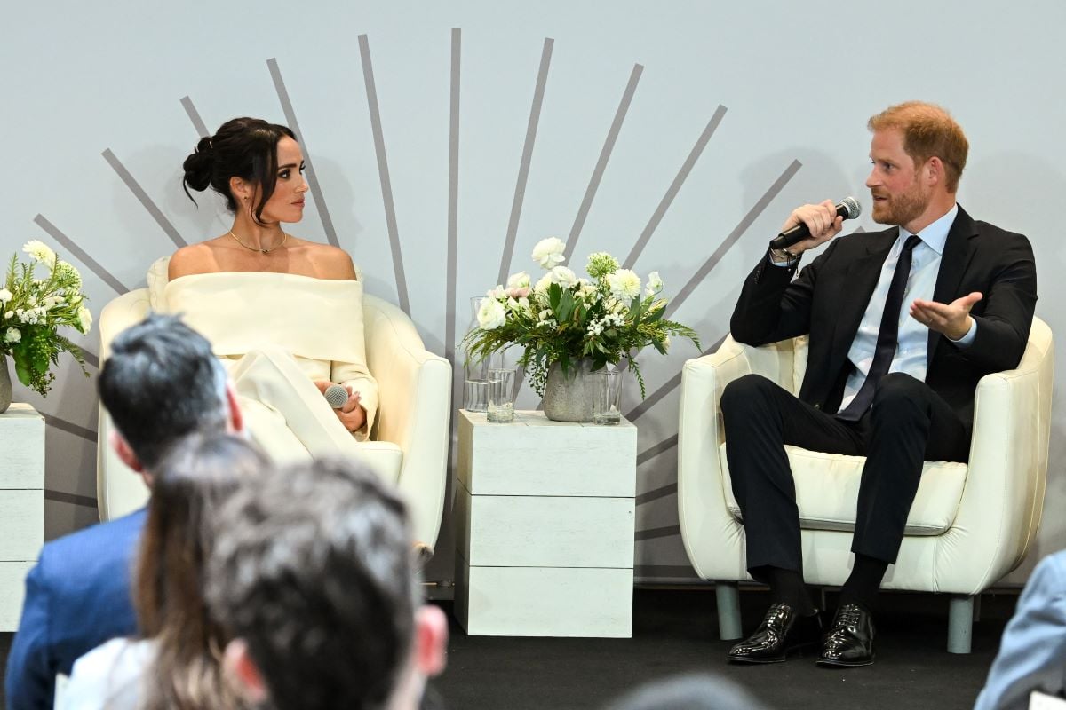 Meghan Markle and Prince Harry speaking onstage during the Project Healthy Minds' World Mental Health Day Festival