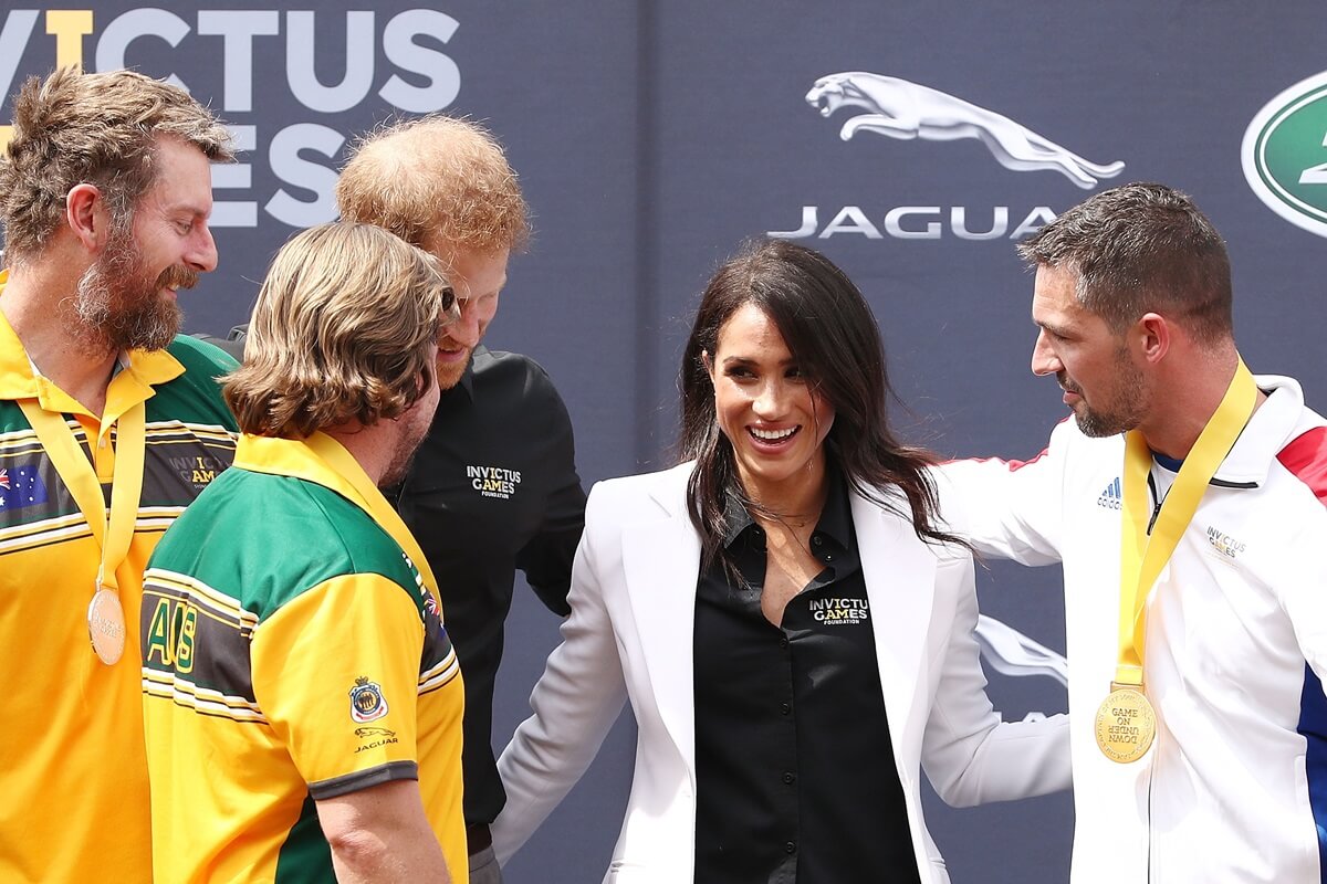 Meghan Markle poses with Prince Harry and Invictus Games medalists in Australia