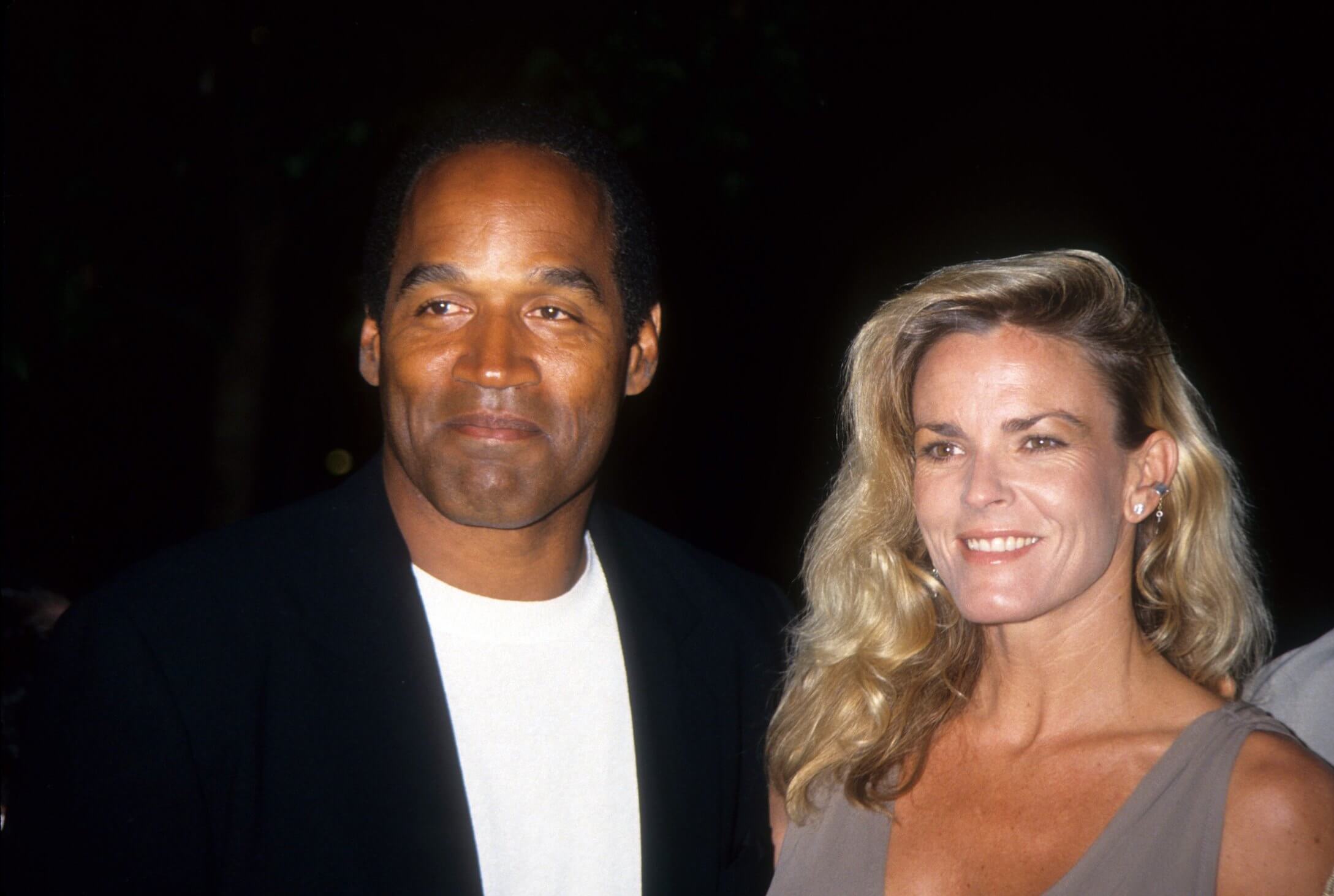 O.J. Simpson standing next to Nicole Brown Simpson