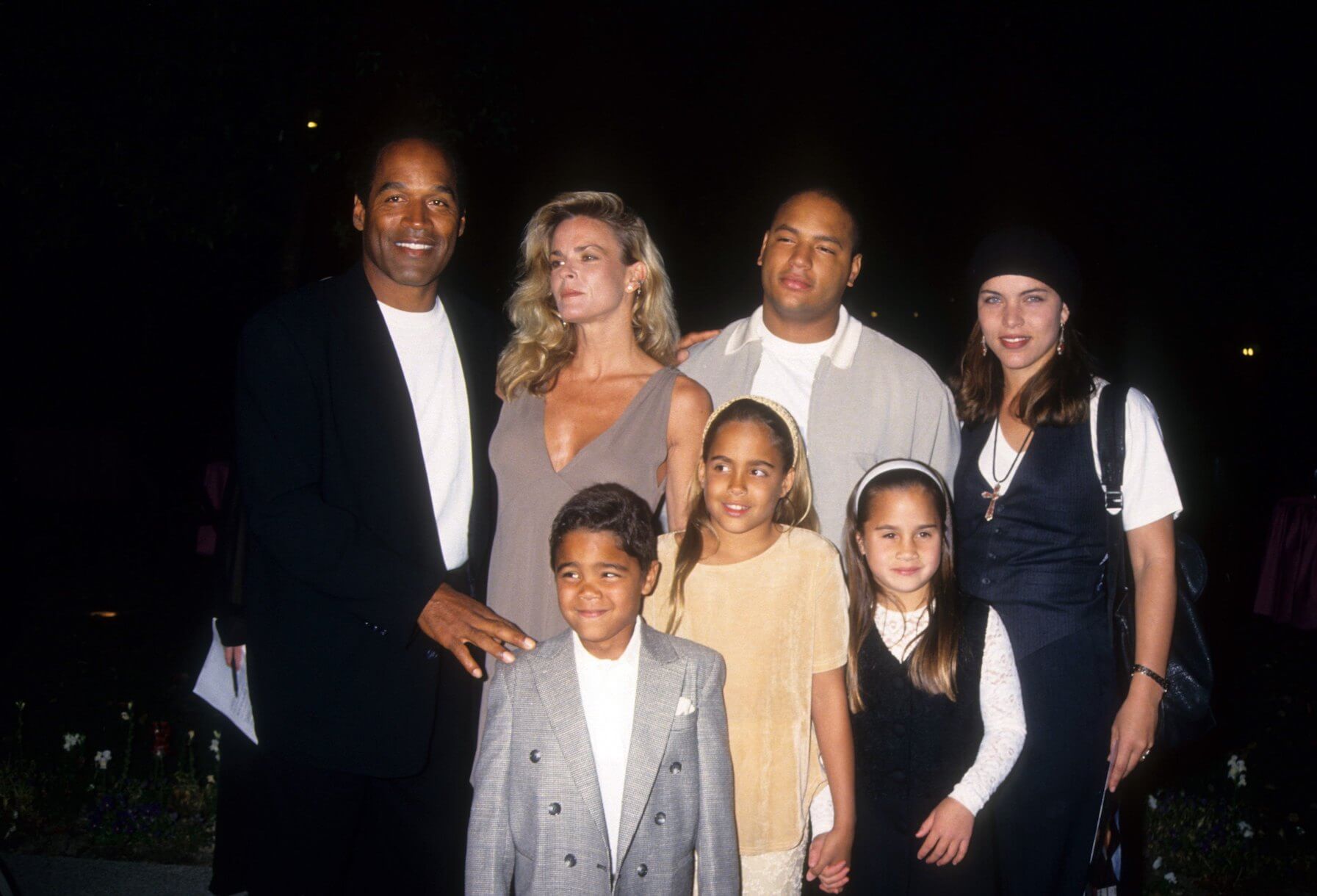 O.J. Simpson, Nicole Brown Simpson, Jason Simpson, Sydney Brooke Simpson, and Justin Ryan Simpson posing together at a movie premiere