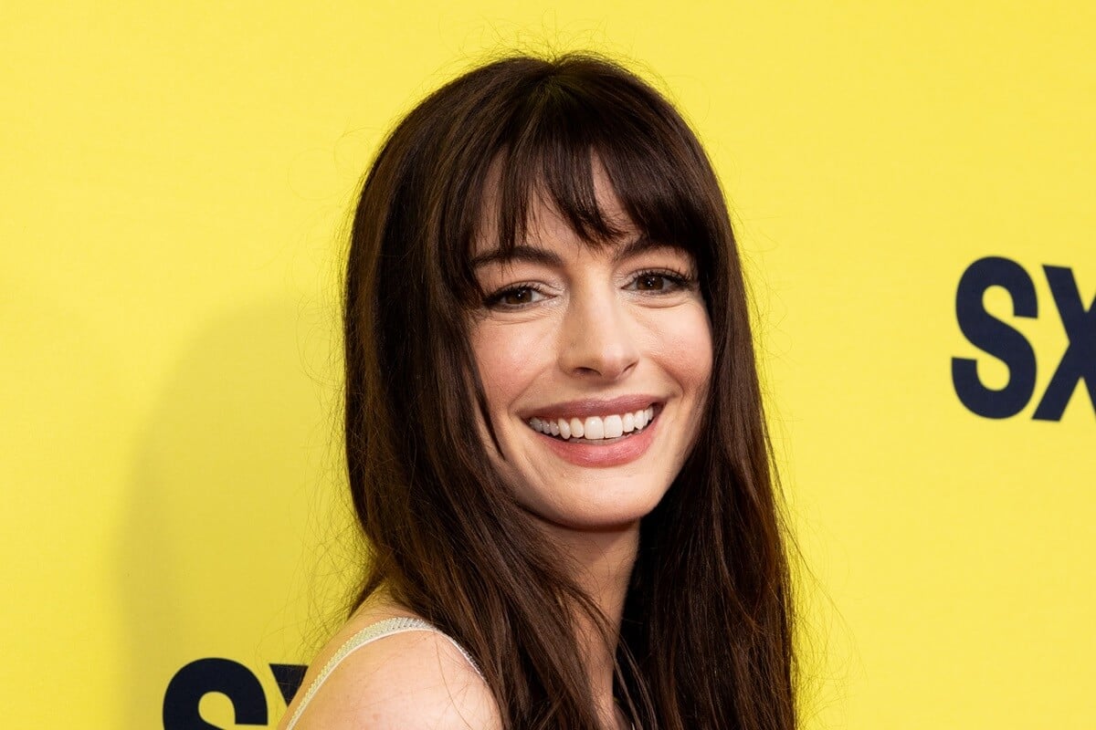 Anne Hathaway smiling at the world premiere of "The Idea of You".