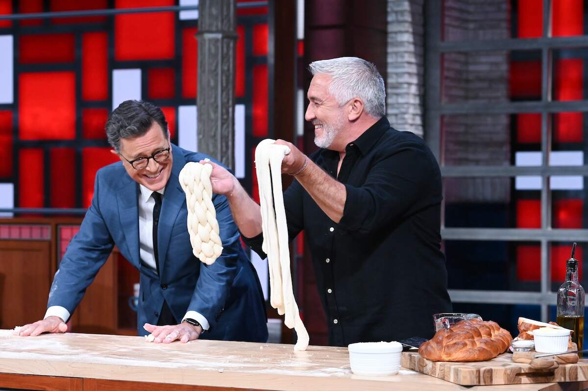 Paul Hollywood laughs with Stephen Colbert while they knead dough on The Late Show