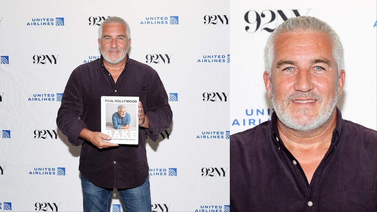 Celebrity chef Paul Hollywood holds up his new cookbook for photographers