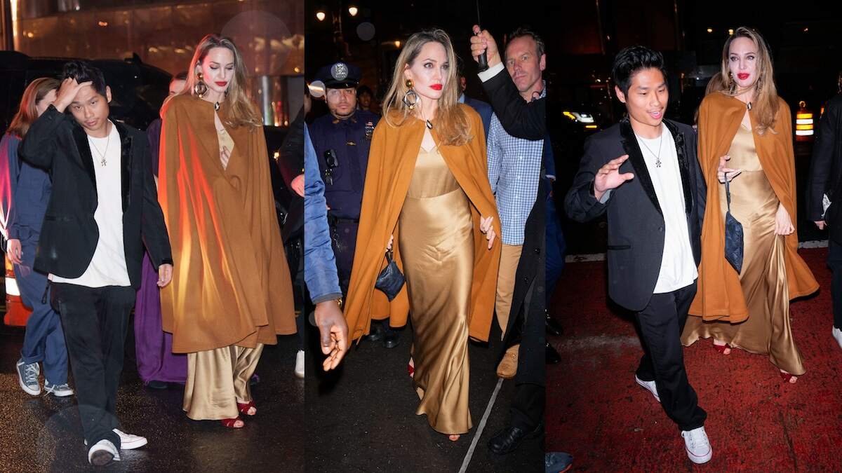 Angelina Jolie and Pax Jolie-Pitt walk from their vehicle to the red carpet together