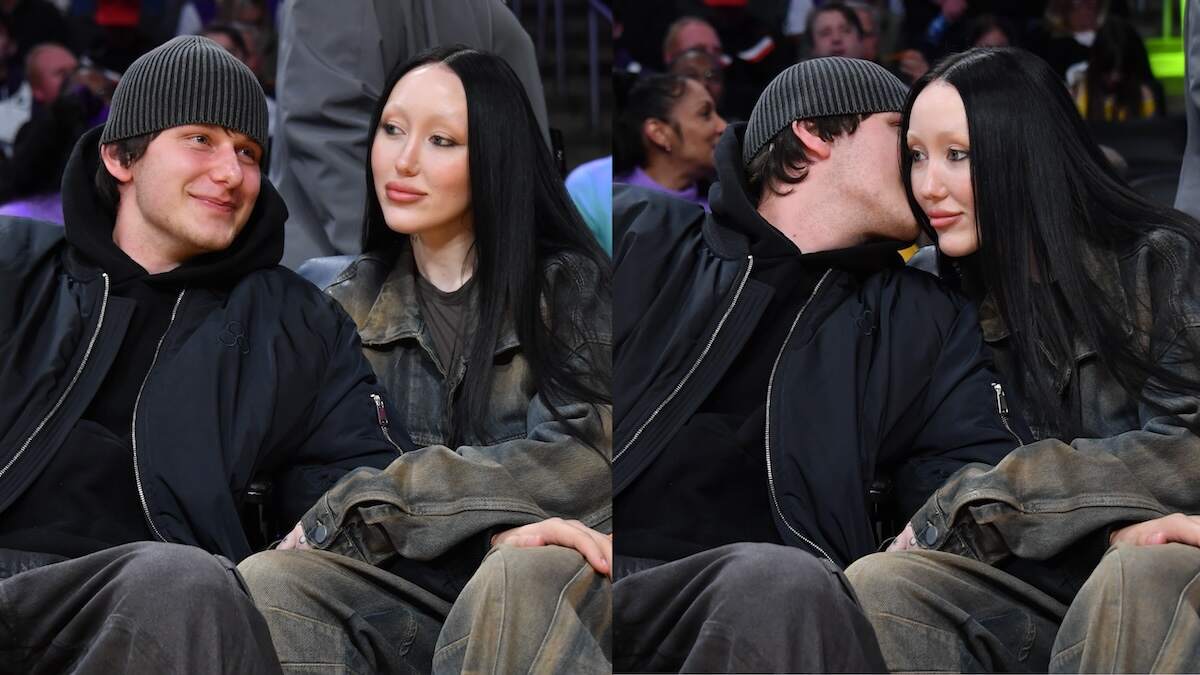 Pinkus and Noah Cyrus sit together courtside at a Lakers game with their hands on each others' legs