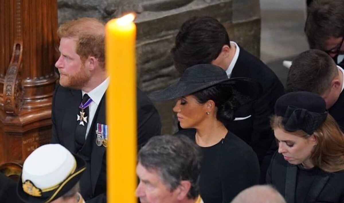 Prince Harry and Meghan Markle seated next and Princess Beatrice during the State Funeral of Queen Elizabeth II at Westminster Abbey