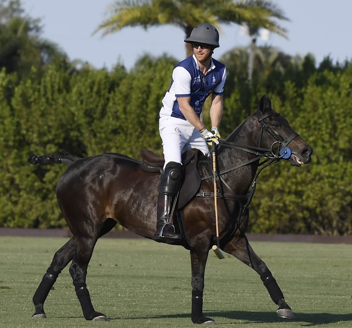 Prince Harry competes during the Royal Salute Polo Challenge benefitting Sentebale at Grand Champions Polo Club