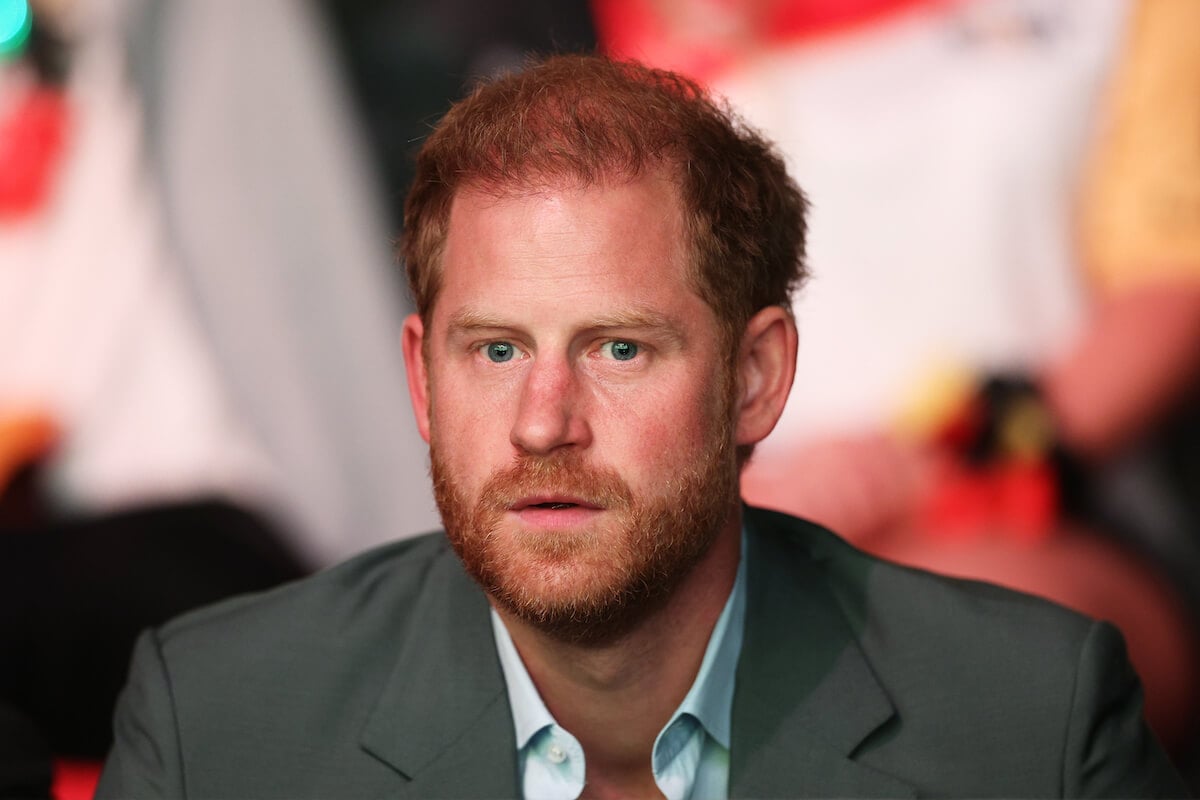 Prince Harry, who is a 'tragedy in the making,' per an author, looks on