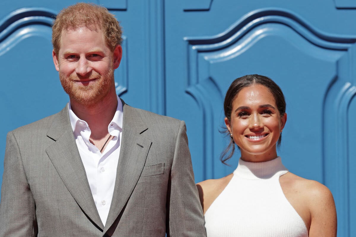 Prince Harry, who's 'uncomfortable' with 'commercial' aspect of American Riviera Orchard, with Meghan Markle smile standing next to each other