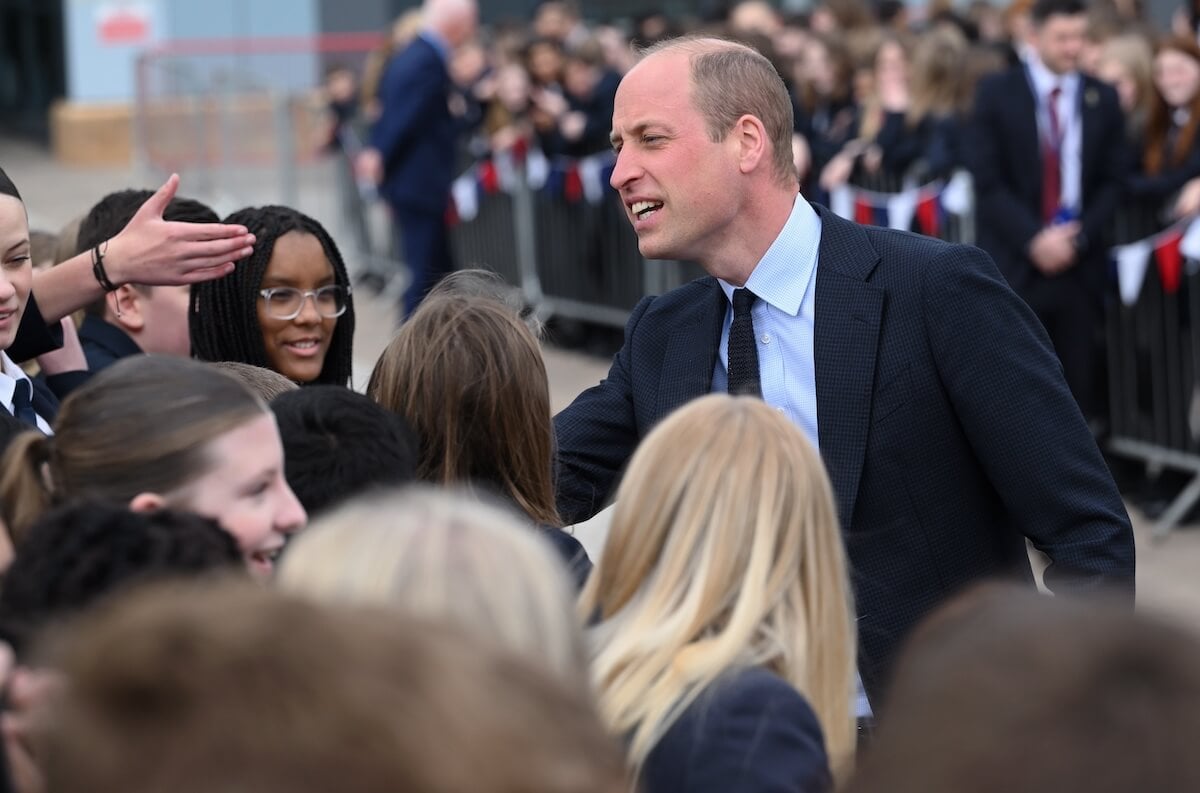 Prince William greets students at St. Michael's Church of England School on April 25