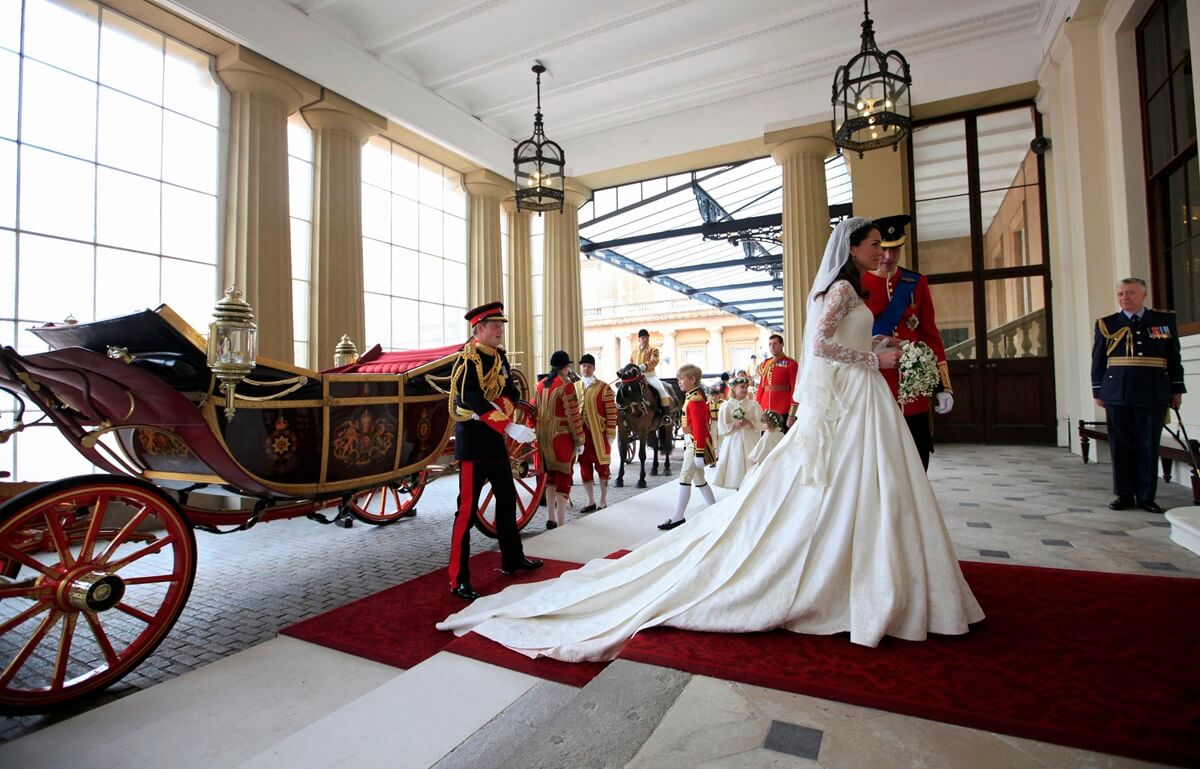 Prince William and Kate Middleton arrive at Buckingham Palace after their wedding at Westminster Abbey