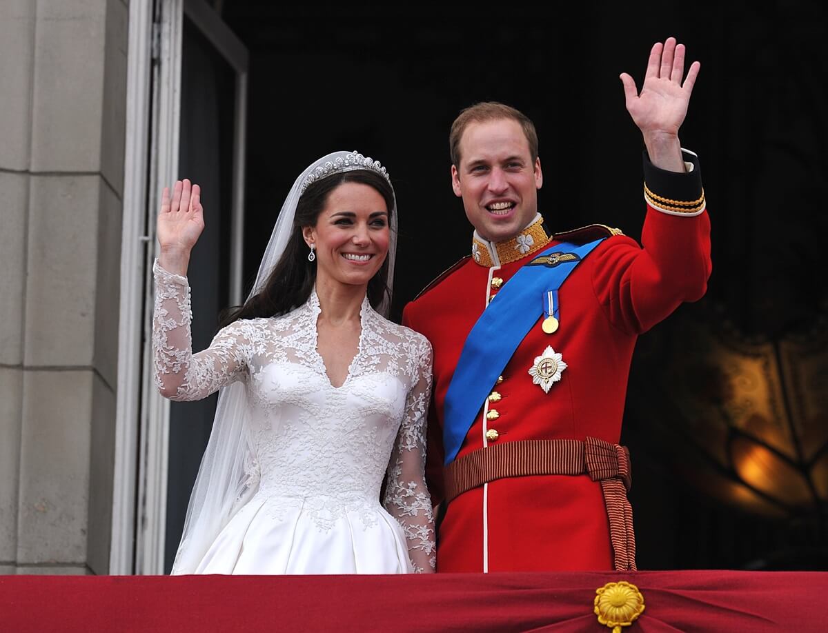 Prince William and Kate Middleton wave from on the balcony at Buckingham Palace during the Royal Wedding