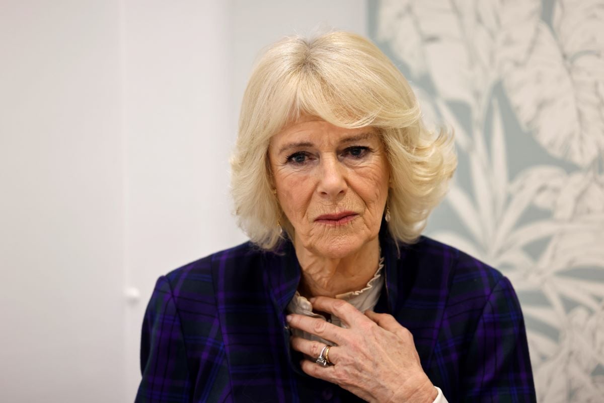 Queen Camilla reacts as she speaks to a sexual assault survivor during a visit at the clinic in London, England